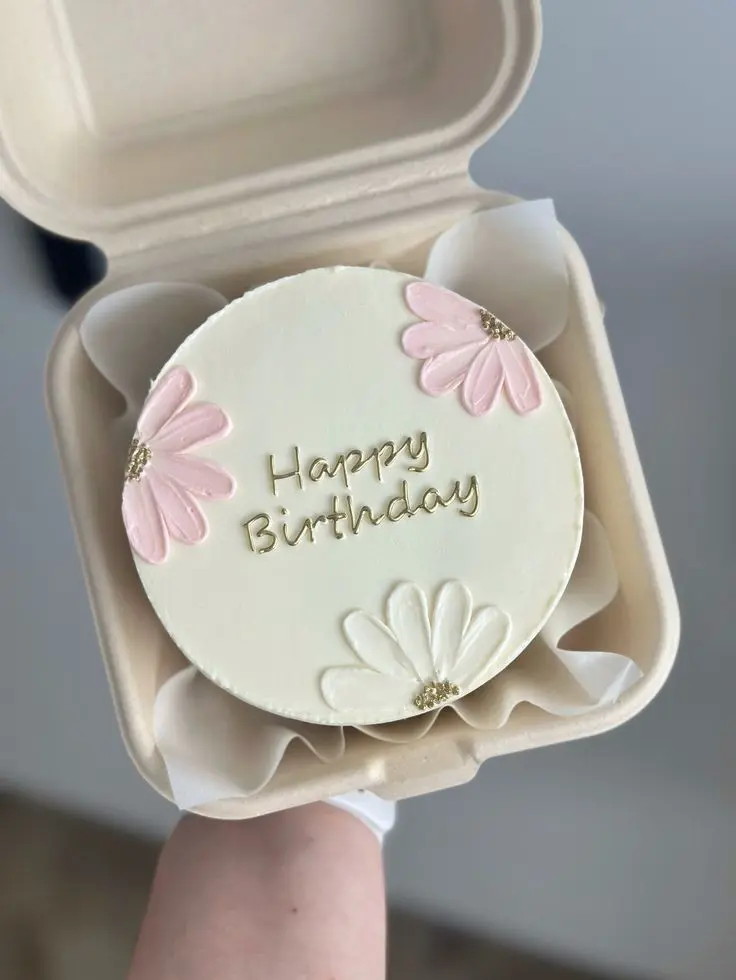 Freshly baked bento cake with custom design.